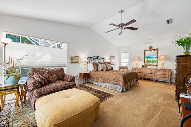 bedroom featuring carpet, visible vents, vaulted ceiling, and a ceiling fan