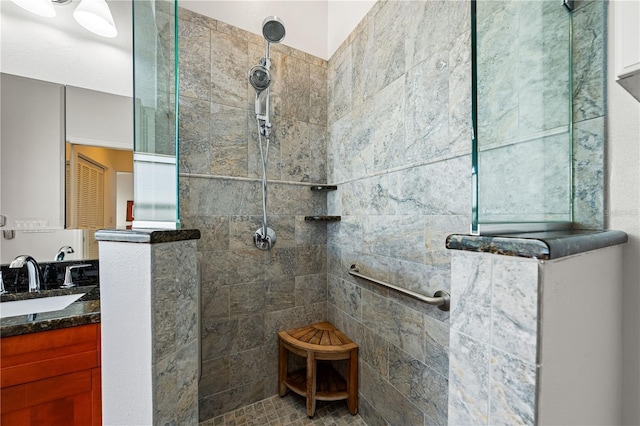 bathroom with walk in shower and vanity