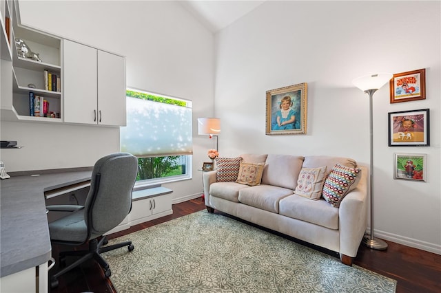 office with high vaulted ceiling, baseboards, and wood finished floors