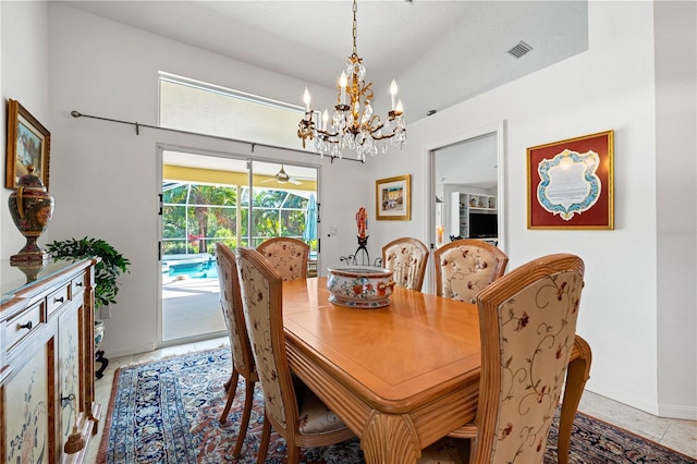 dining space with light tile patterned floors, a sunroom, visible vents, and an inviting chandelier