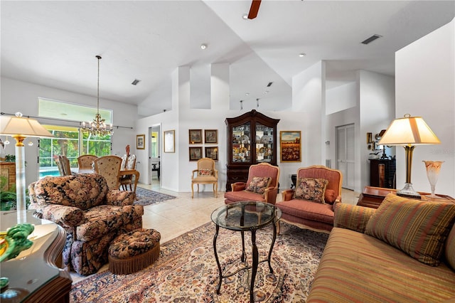 living room featuring visible vents, baseboards, an inviting chandelier, high vaulted ceiling, and light tile patterned flooring