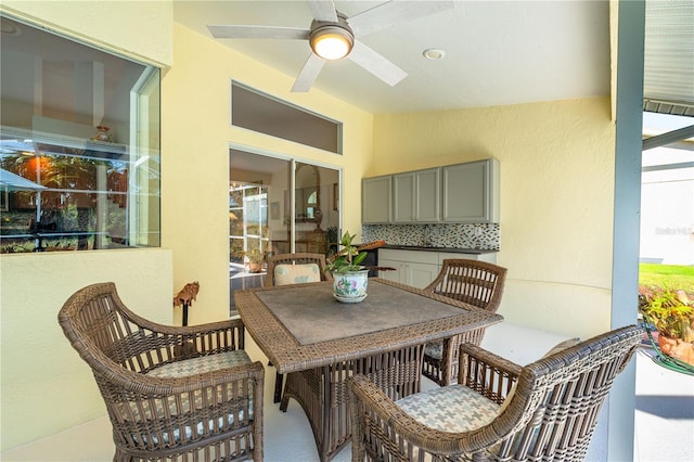 view of patio with ceiling fan and outdoor dining space