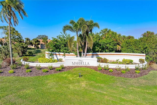 community / neighborhood sign with a lawn