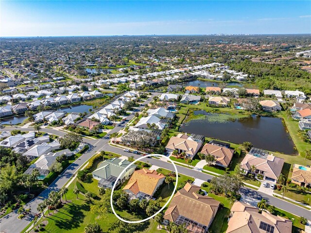 aerial view featuring a residential view and a water view