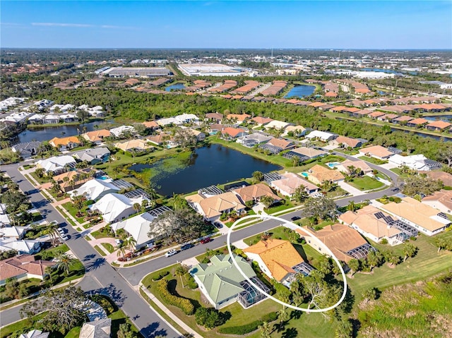 bird's eye view with a water view and a residential view