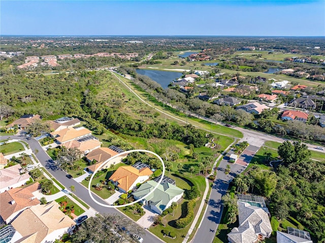 aerial view featuring a water view and a residential view