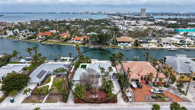 bird's eye view featuring a water view and a residential view