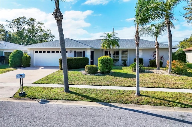 ranch-style house featuring an attached garage, stucco siding, a front lawn, roof with shingles, and driveway