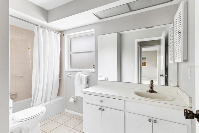 bathroom featuring tile patterned flooring, toilet, vanity, and shower / tub combo with curtain