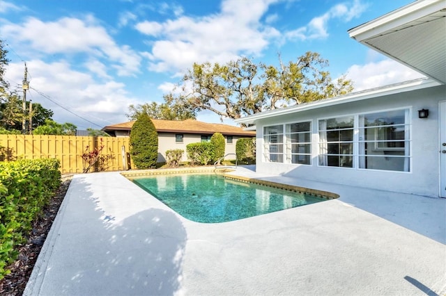 view of pool featuring a fenced in pool, a patio, and fence