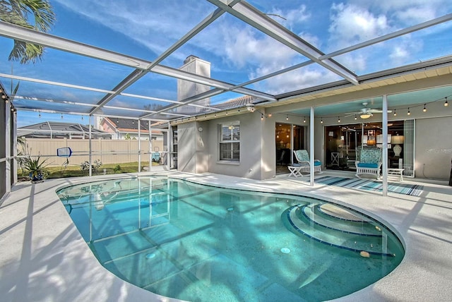 view of pool featuring a patio area, a lanai, a fenced in pool, and fence