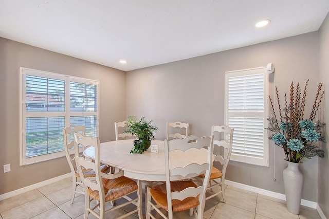 dining room featuring recessed lighting, baseboards, and light tile patterned flooring