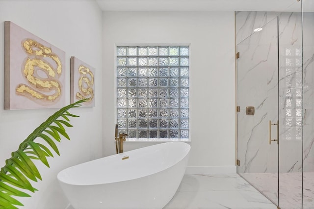 full bathroom with marble finish floor, a marble finish shower, and a soaking tub