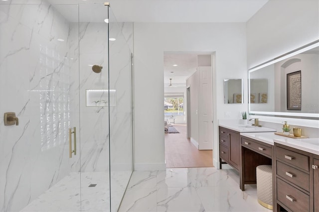 full bathroom with recessed lighting, vanity, baseboards, marble finish floor, and a marble finish shower