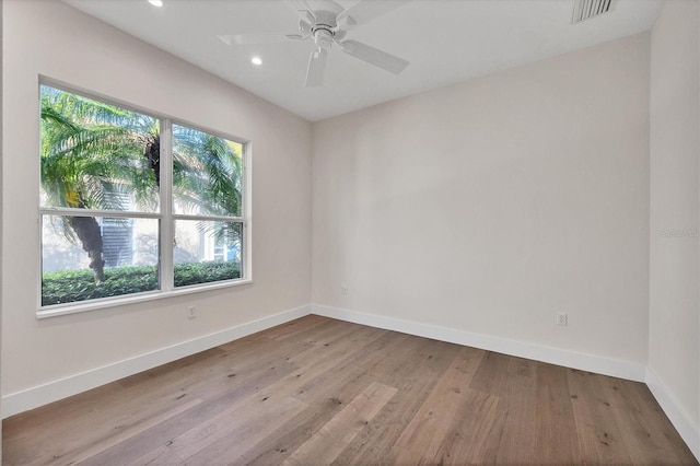 empty room featuring baseboards, visible vents, ceiling fan, wood-type flooring, and recessed lighting