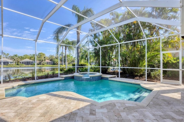 view of swimming pool featuring a patio area, a water view, a pool with connected hot tub, and a lanai