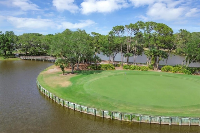 view of property's community featuring view of golf course and a water view