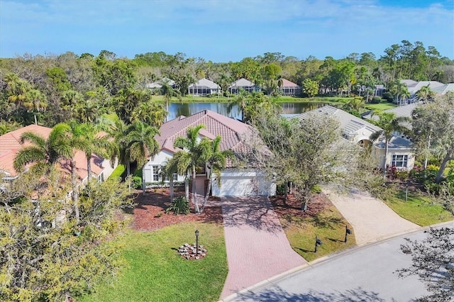 aerial perspective of suburban area featuring a nearby body of water