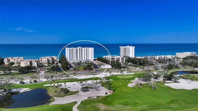aerial view with a water view and golf course view