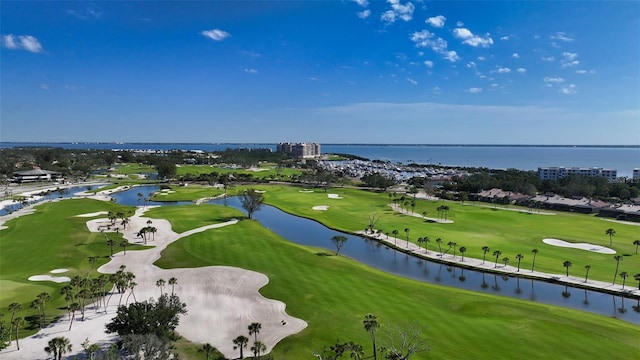 bird's eye view featuring a water view and golf course view