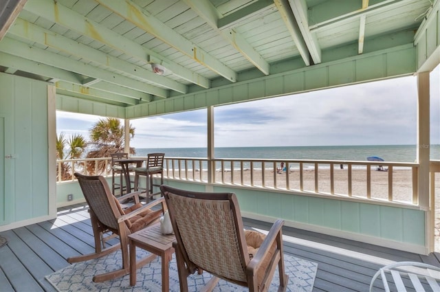 wooden deck with a water view