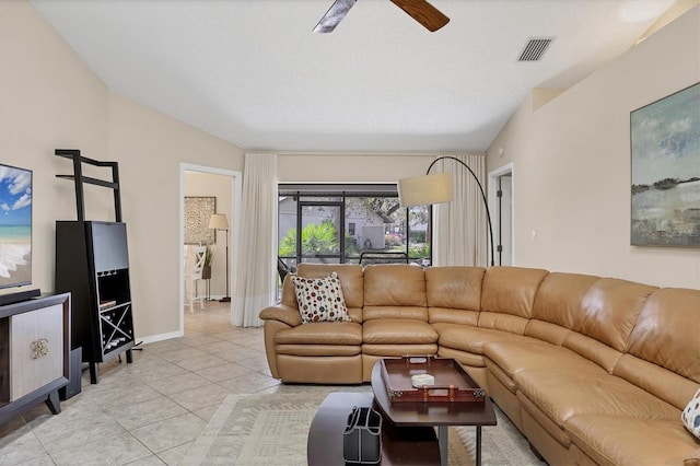 living room with visible vents, ceiling fan, baseboards, and light tile patterned floors