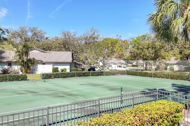 view of sport court with fence