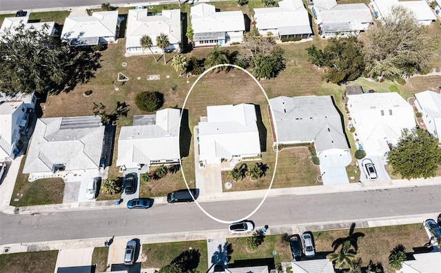 birds eye view of property with a residential view