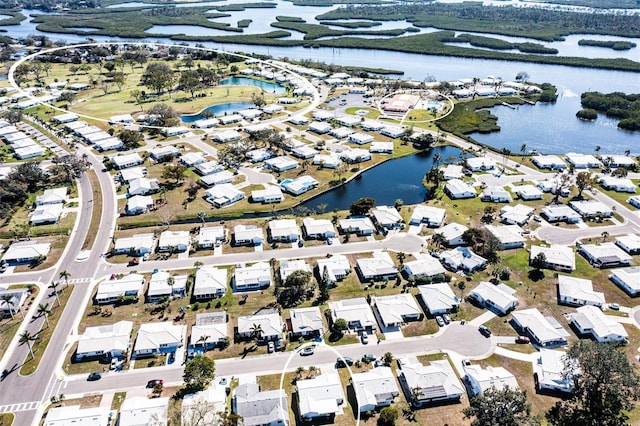 birds eye view of property featuring a residential view and a water view