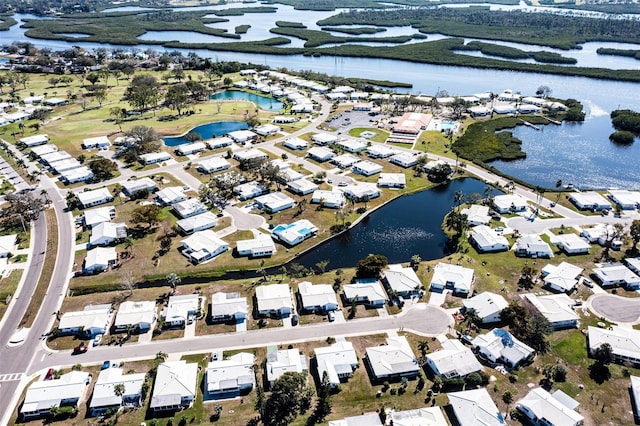 bird's eye view featuring a water view and a residential view