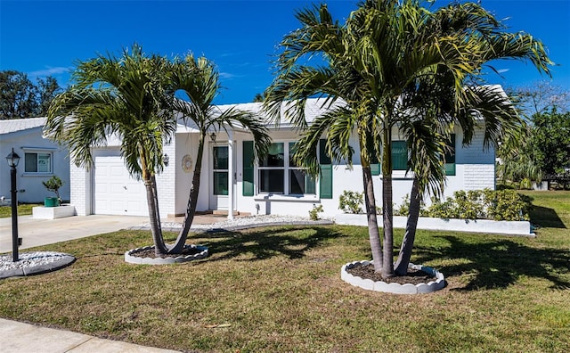 obstructed view of property featuring a garage, brick siding, driveway, and a front lawn