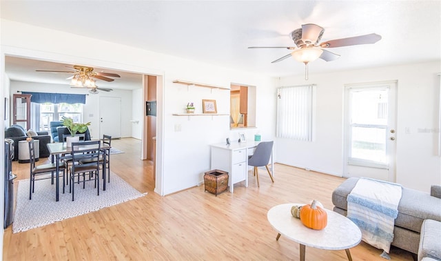 interior space featuring light wood-style floors and a ceiling fan