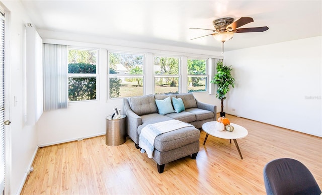 sunroom with a ceiling fan