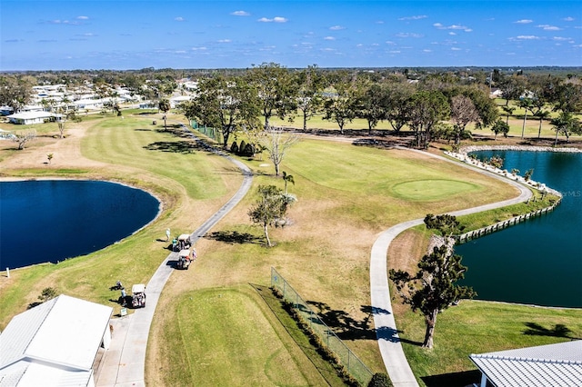 bird's eye view with golf course view and a water view