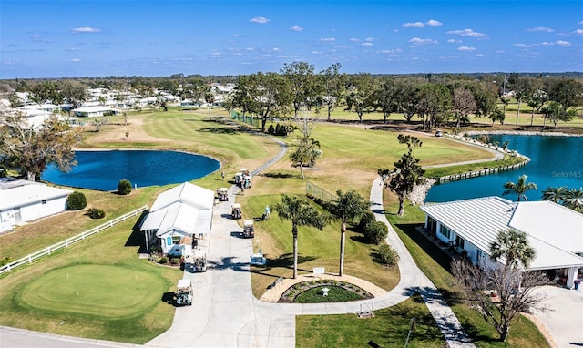 aerial view featuring a water view and view of golf course