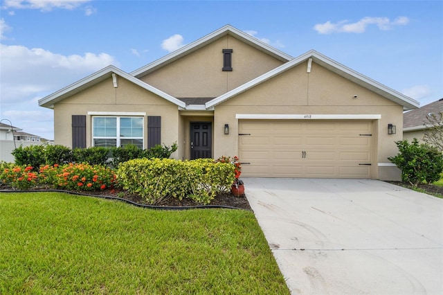 4918 Gray Owl Ter, Palmetto, FL 34221 - view of front of home with stucco siding, a garage, a front yard, and concrete driveway