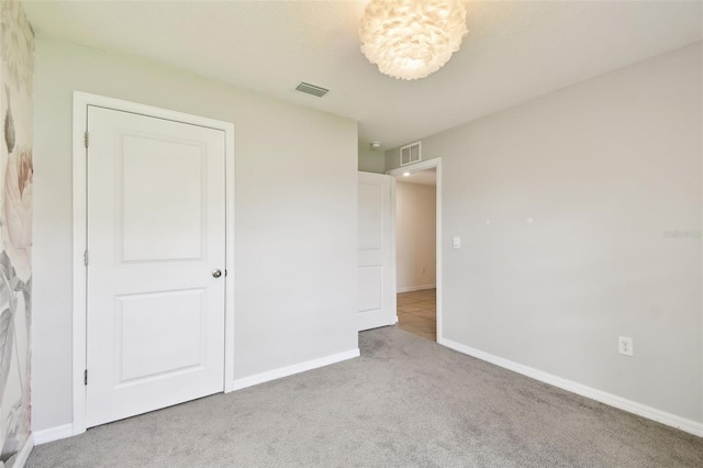 4918 Gray Owl Ter, Palmetto, FL 34221 - unfurnished bedroom featuring light carpet and baseboards