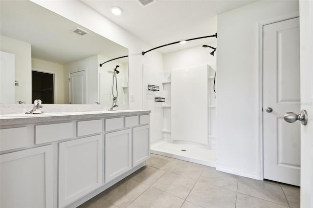 4918 Gray Owl Ter, Palmetto, FL 34221 - bathroom with a walk in shower, tile patterned floors, and double vanity