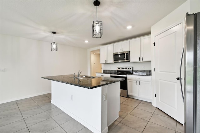 4918 Gray Owl Ter, Palmetto, FL 34221 - kitchen featuring stainless steel appliances, light tile patterned flooring, white cabinetry, a center island with sink, and recessed lighting