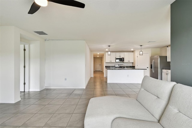 4918 Gray Owl Ter, Palmetto, FL 34221 - living room with a ceiling fan and light tile patterned floors