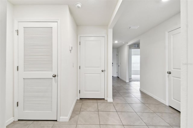 4918 Gray Owl Ter, Palmetto, FL 34221 - hallway featuring light tile patterned floors and recessed lighting