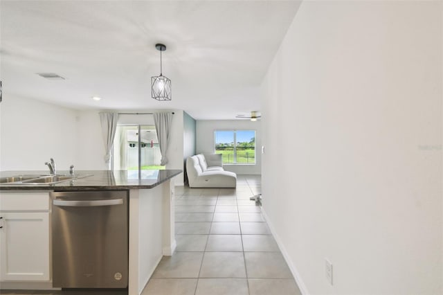 4918 Gray Owl Ter, Palmetto, FL 34221 - kitchen with dishwasher, light tile patterned floors, white cabinetry, open floor plan, and decorative light fixtures