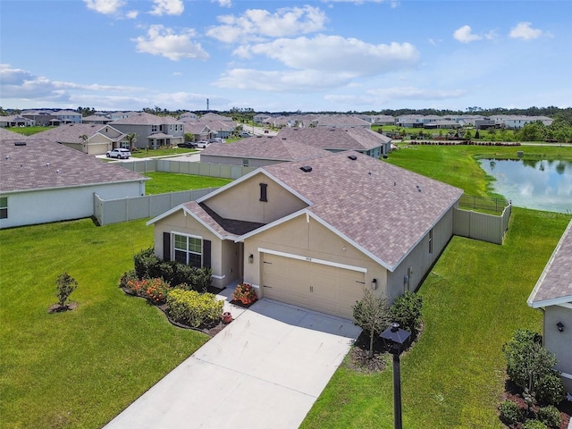 4918 Gray Owl Ter, Palmetto, FL 34221 - view of front of house with a garage, a residential view, stucco siding, concrete driveway, and a water view
