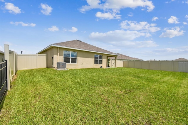 4918 Gray Owl Ter, Palmetto, FL 34221 - rear view of property with stucco siding, a fenced backyard, and a shingled roof