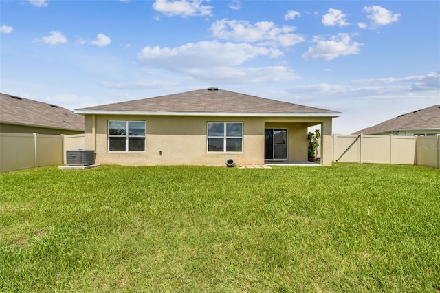4918 Gray Owl Ter, Palmetto, FL 34221 - back of property with stucco siding, a shingled roof, a fenced backyard, and a patio area