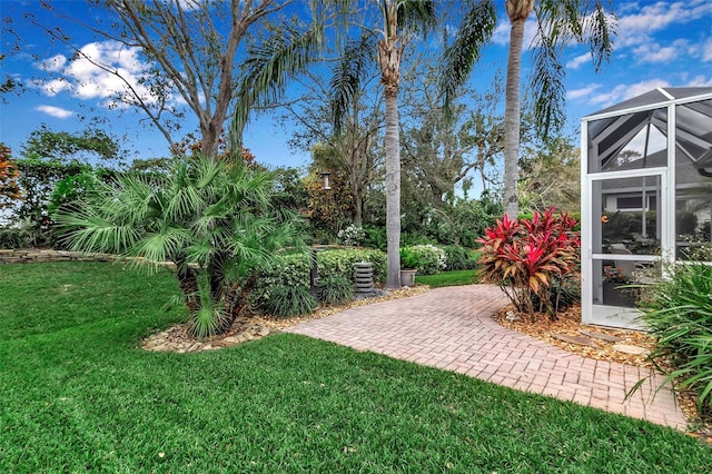 view of yard featuring a lanai