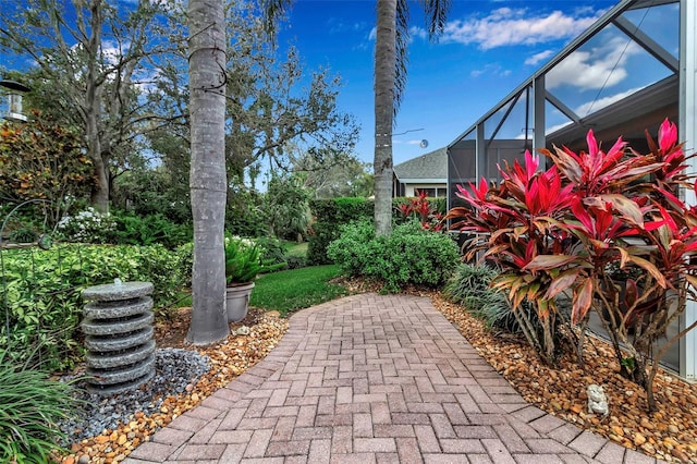 view of patio / terrace featuring a lanai