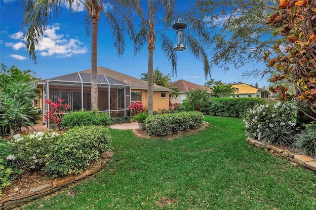 view of yard with a lanai