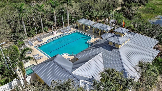 community pool featuring a patio area, fence, and a gazebo