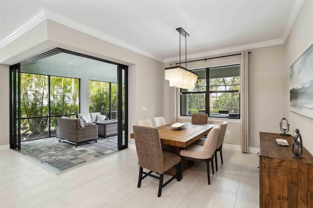 dining room featuring ornamental molding and baseboards